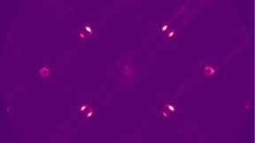  Lasing emission in momentum space from a supercell array.