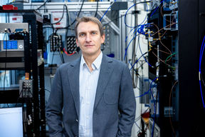 Aalto University Senior Lecturer Sorin Paraoanu stands at the Low Temperature Lab in the Nanotalo building.