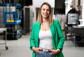 Professor Dessbesell in a lab, wearing a green jacket