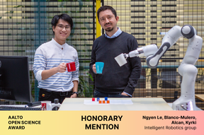 Two of the awardees and their robotic arm all holding colorful mugs. Aalto Open Science Award, Honorary mention.