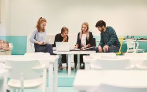 Four people gathered around a table