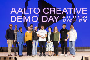 A group photo of pre-incubator teams on Marsio Stage at the Aalto Creative Demo Day event.