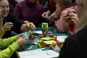 Kids making origami