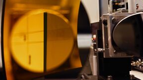 Parabolic reflector with a flat mirror.