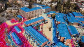 Oblique image of block-scale city model in game engine with overlaid watershed analysis visualization.