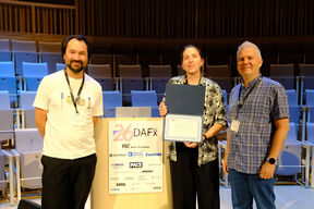 Gloria Dal Santo (middle) and her advisors, Prof. Sebastian Schlecht (left) and Prof. Vesa Välimäki (right) received the Best Paper Award diploma at the MIT Music building.