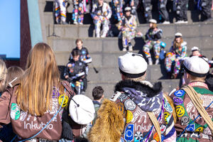 Students wearing overalls and student caps