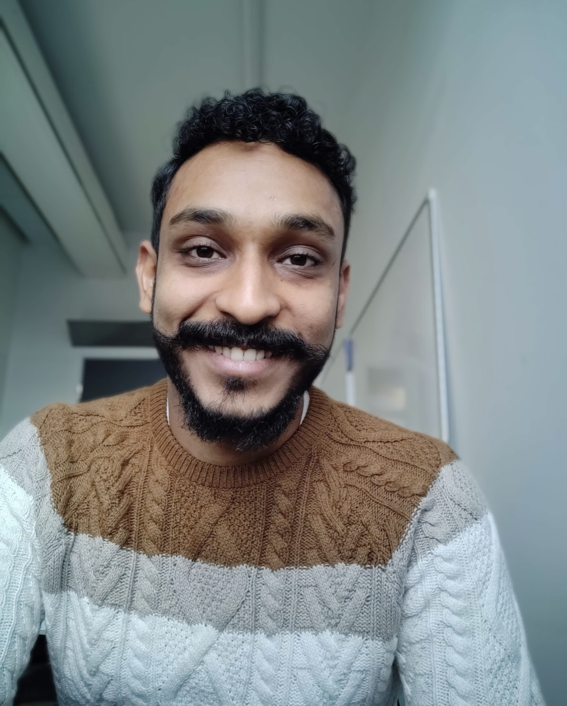 Photo showing doctoral student Kunal Ghosh smiling