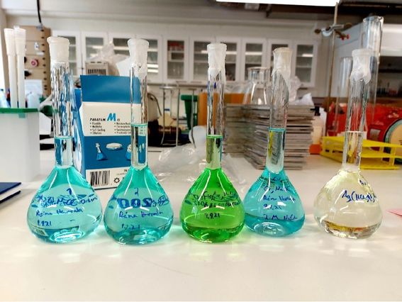 Solutions used for deposition, with varying concentrations of ions. Photo by Aalto University, Reima Herrala