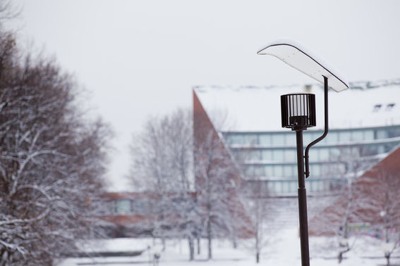 Lamp on Alvar Aallon aukio in the winter, Undergraduate Centre in the background