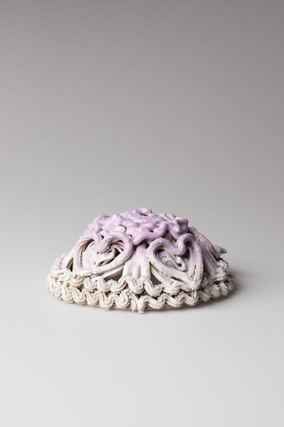 a cake looking ceramic sculpture