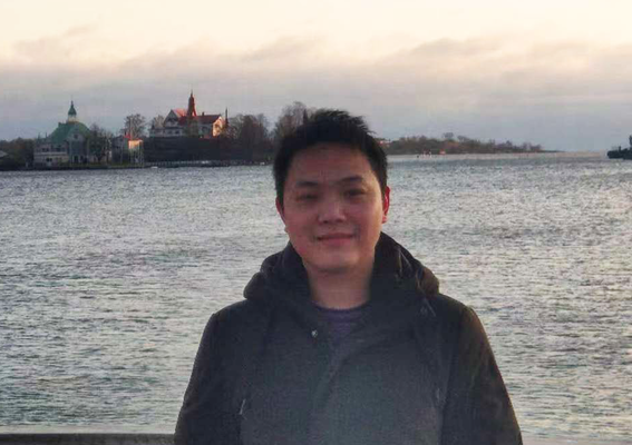 A person standing by water