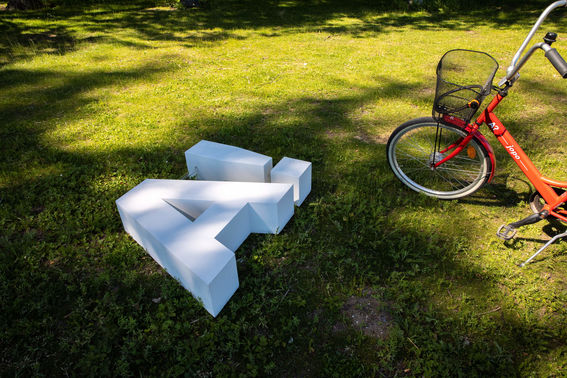 Aalto logo flat on the ground next to a bike