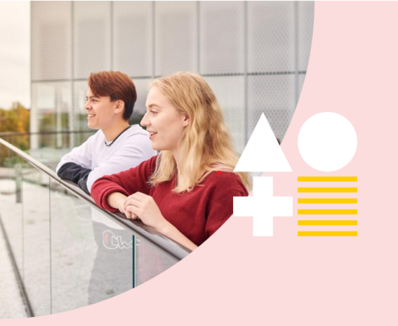 Two people looking over a fence