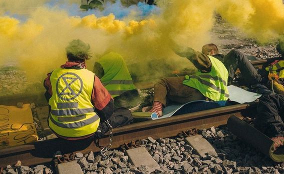 Elokapina members on the train tracks with the intention of stopping the Russian coal train in the spring of 2023