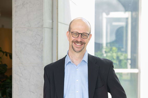 Jussi Ryynänen smiling.