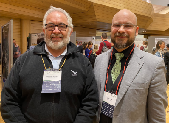 Professor Leonardo Reyneri from PoliTo and professor Jaan Praks from Aalto University standing in a seminar hall at the Winter Satellite Workshop 2024. 