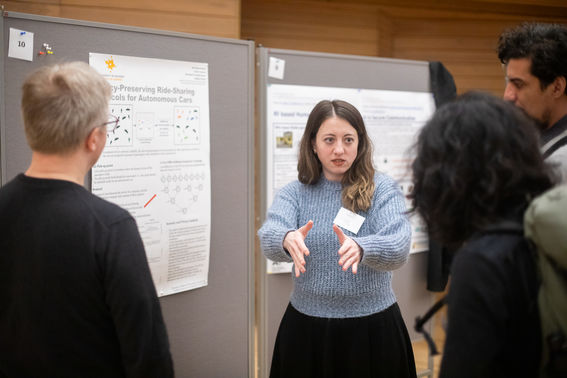 Person presenting a research poster