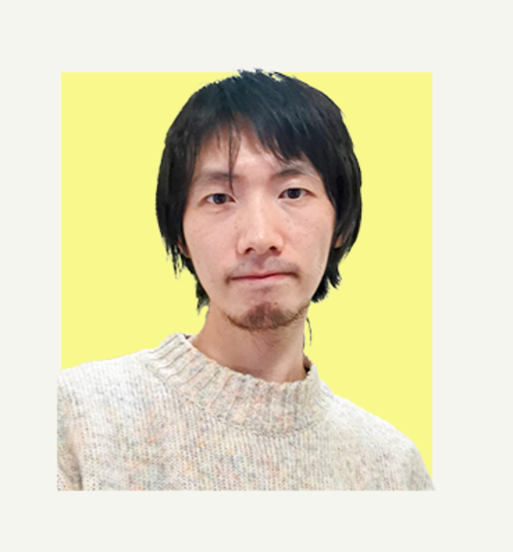 Person with dark hair wearing a light beige jumper against a yellow background.