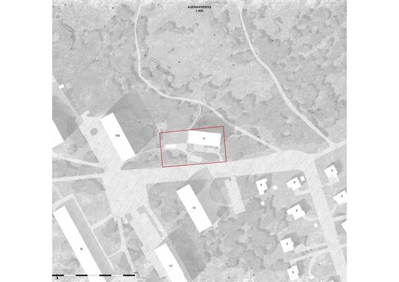 A site plan showing various buildings, greenery and roads, with an area marked in red.