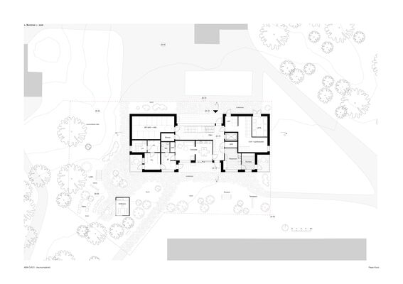 Architectural floor plan of a building surrounded by trees and outdoor furniture. The layout includes rooms and a garden.