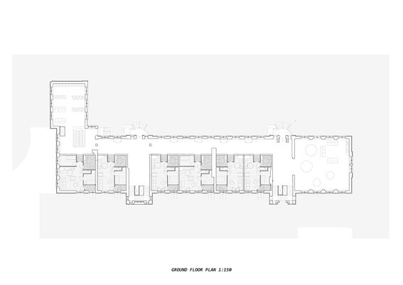Architectural ground floor plan showing rooms, corridors, and furniture layout. Scale 1:150.