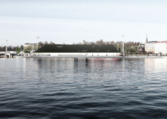 A waterfront view with buildings, trees, and a large dark-roofed structure reflected in the calm water.