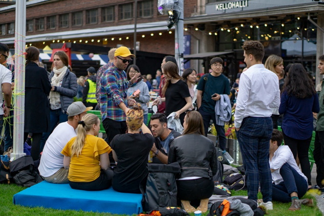Big group of students having a picnic.