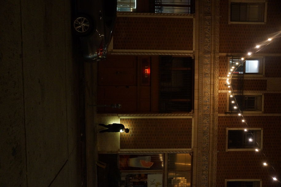 a person walking down the street at night with and e-textile