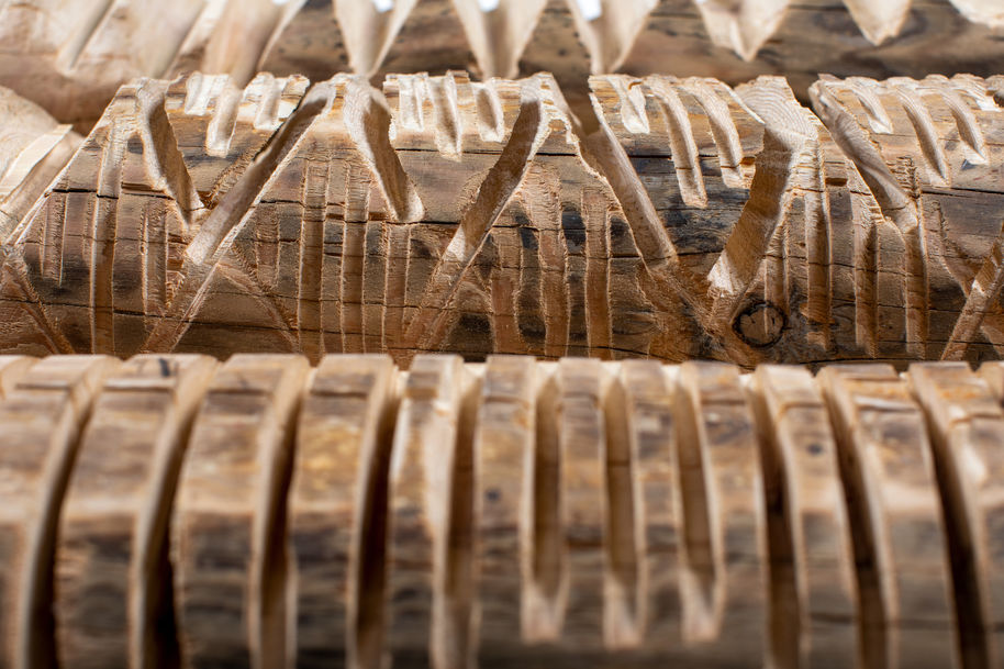 carved pieces of wood in geometric patters