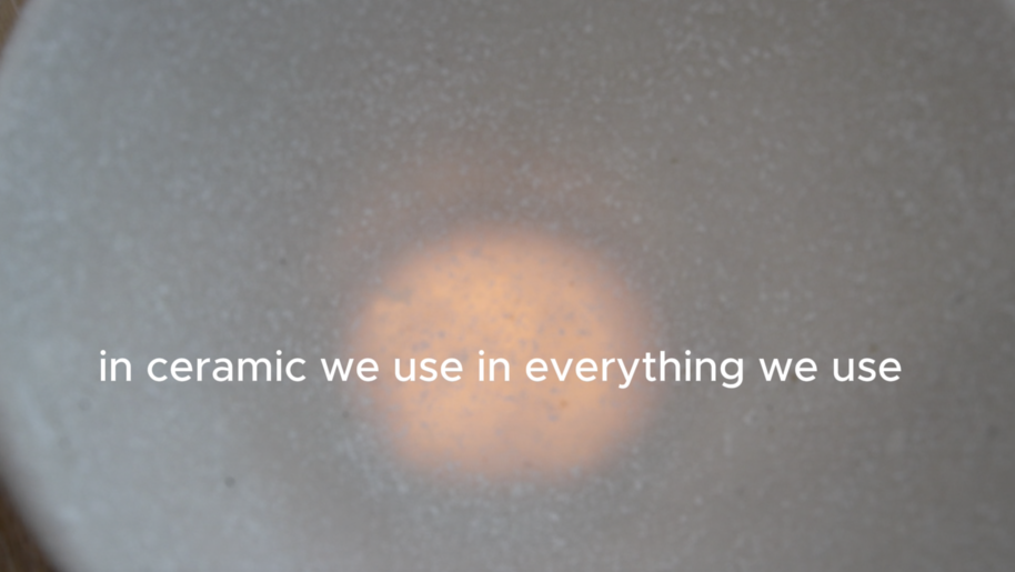 Soft-focus grey ceramic surface with warm orange glow and white text: in ceramic we use in everything we use