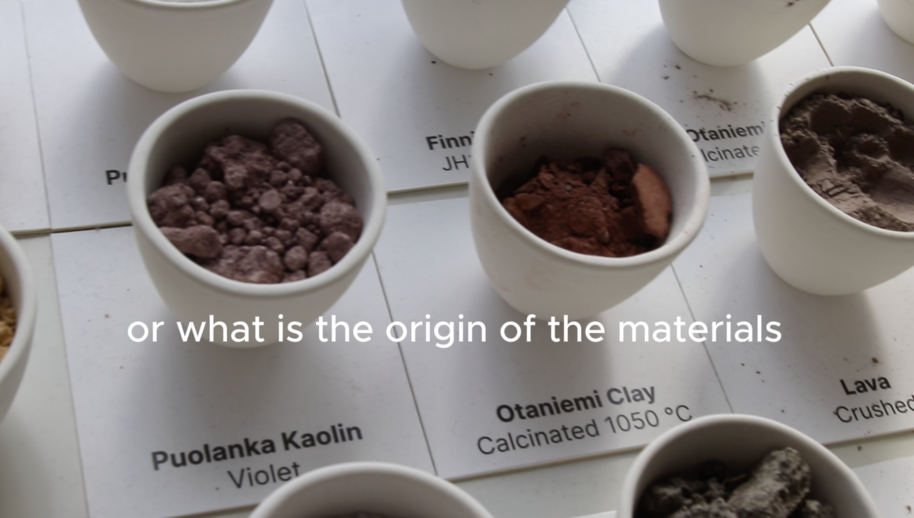 Small white cups hold different clays and rocks on labelled tiles, with text asking the origin of the materials