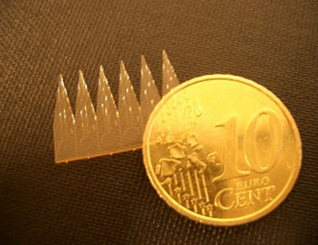 CHEM_Microfabrication group_SU-8 ESI array with coin