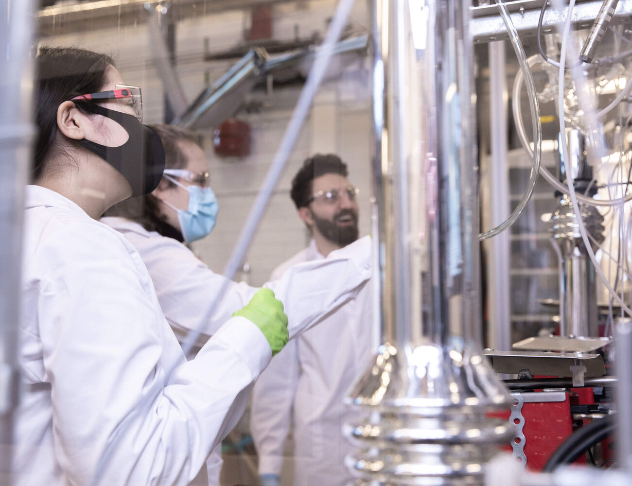 Three scientists working in a laboratory