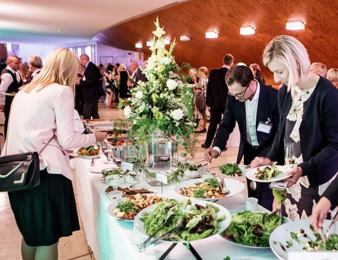 People getting food during Homecoming Day evening program
