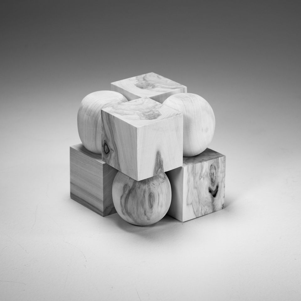 wood cube consisting of alternating cubes and spheres