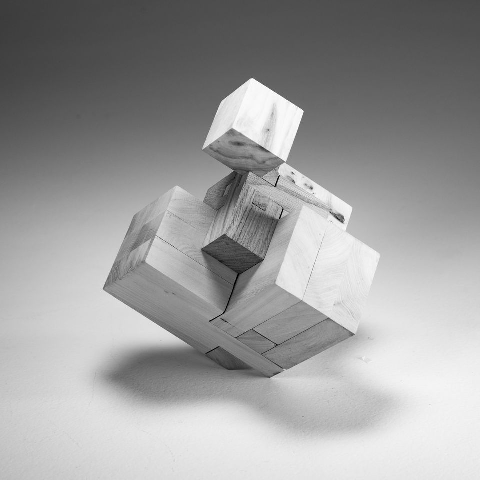 cube consisting of interlocking wooden pieces, japanese joint