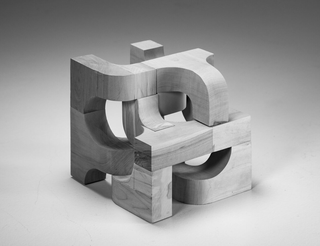 Wood cube made by rounding pieces and joining together to create a graphic outcome