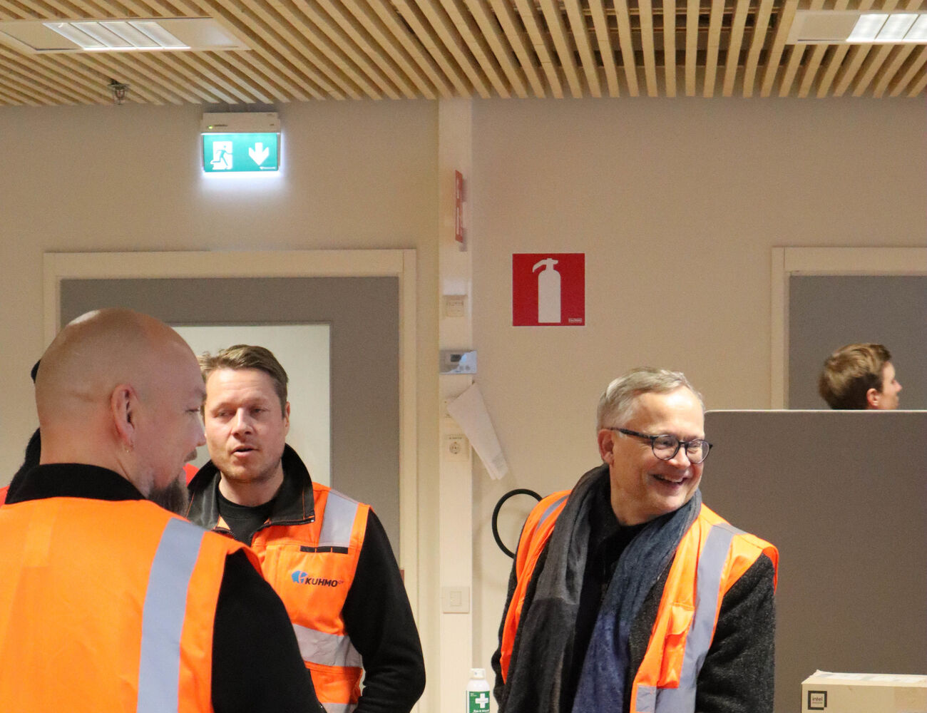 Teachers smiling in Kuhmo Oy control room