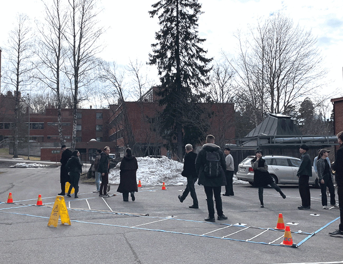 Moving image of students walking around the stage mockup and posing for camera