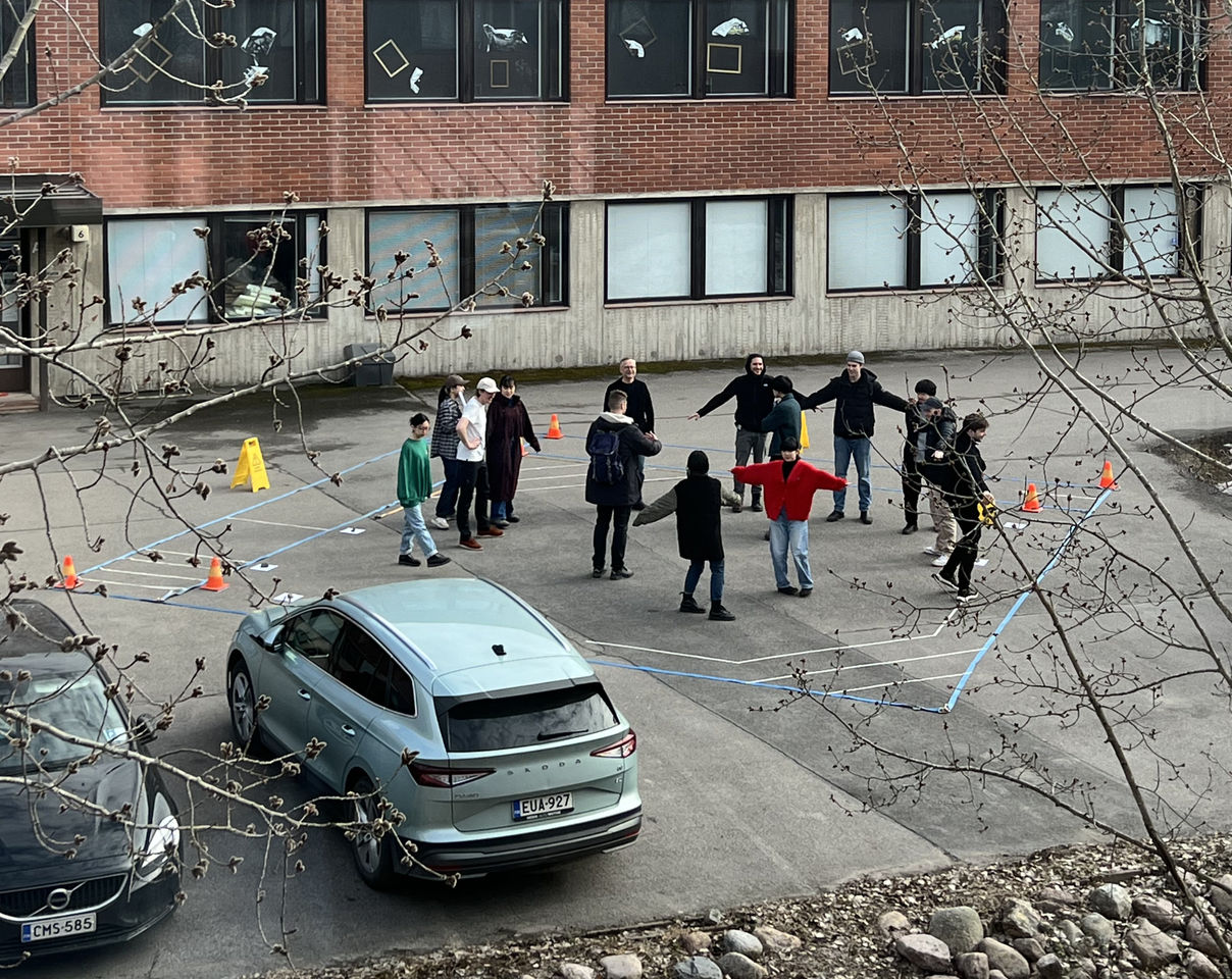 Students walking around the stage mockup
