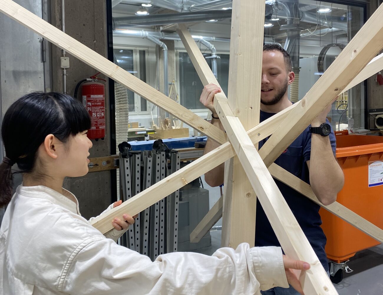 Students making mockup of wooden joint with snowflake shape