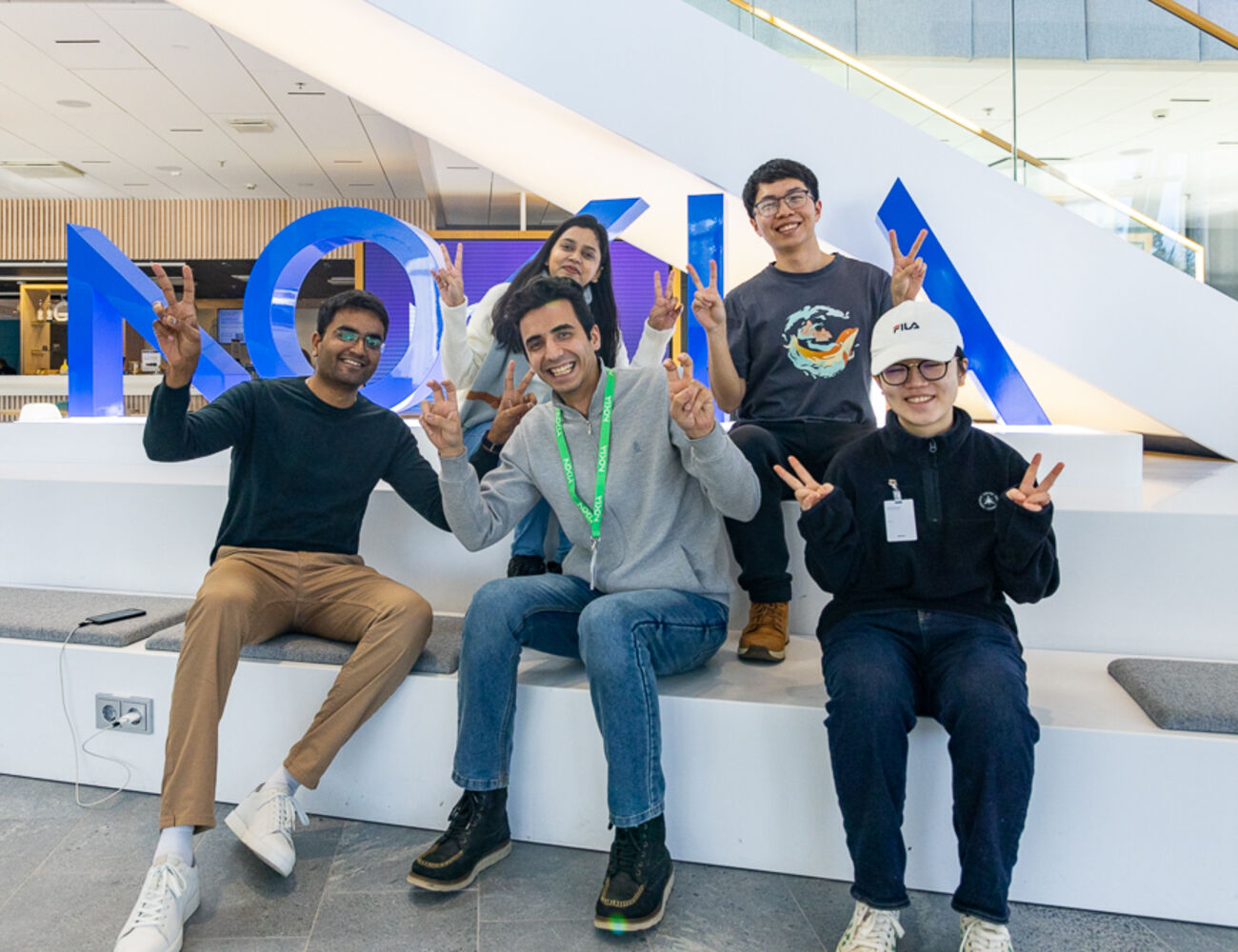 Group of students sitting on stairs.