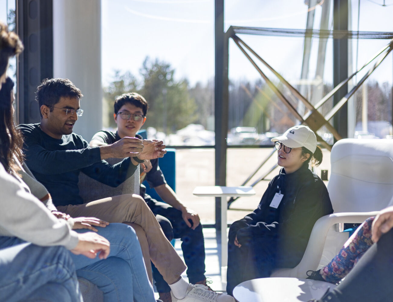 Group of students sitting on a lobby lounge.