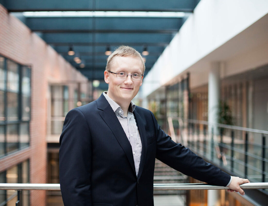 Antti at Aalto Unviersity smiling towards the camera