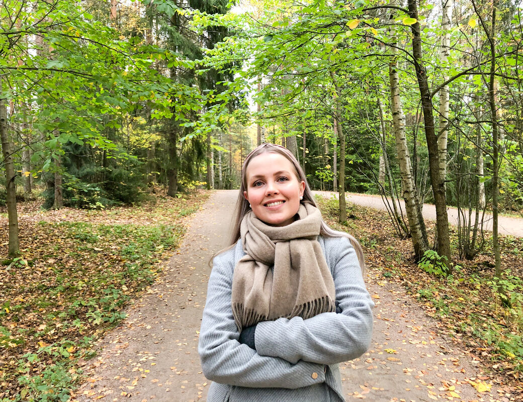 Salli in the forest smiling
