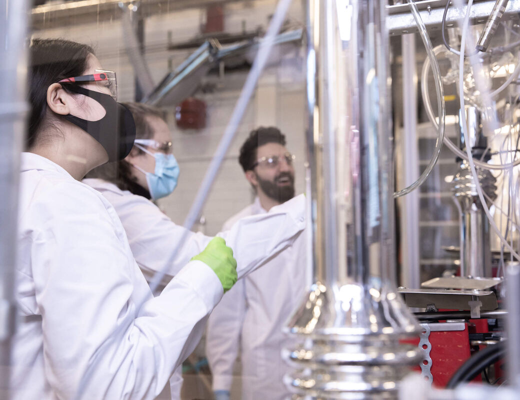 Three scientists working in a laboratory