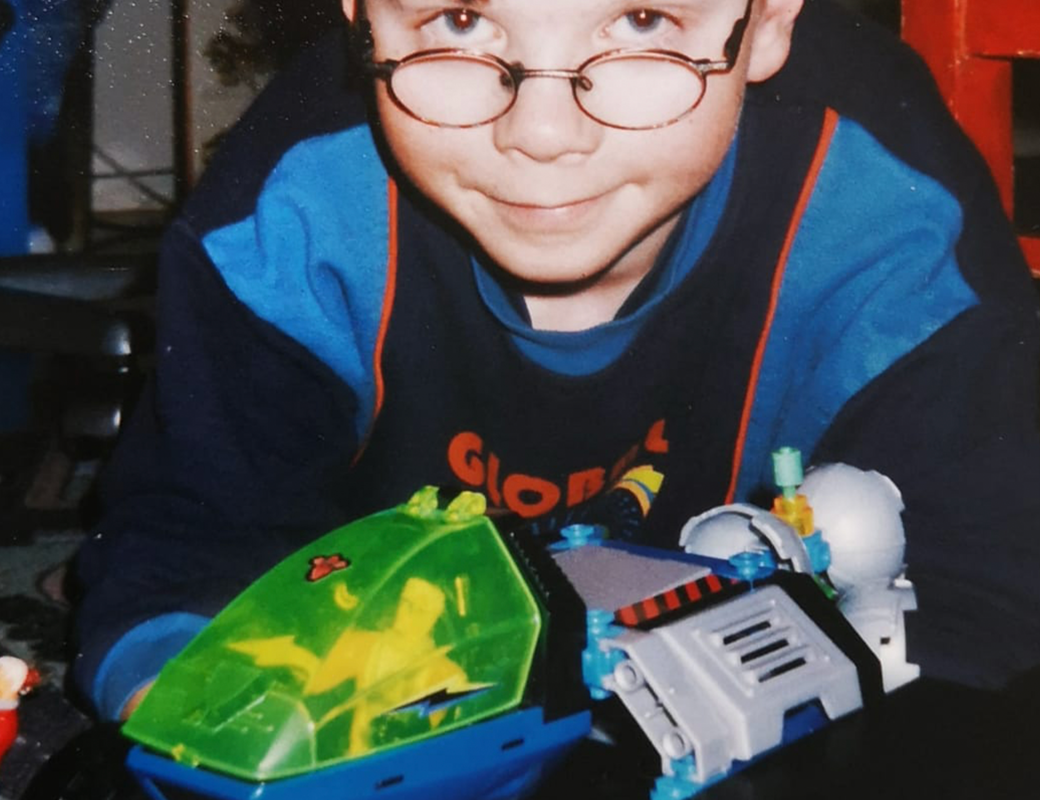 Sakari as a child with toys