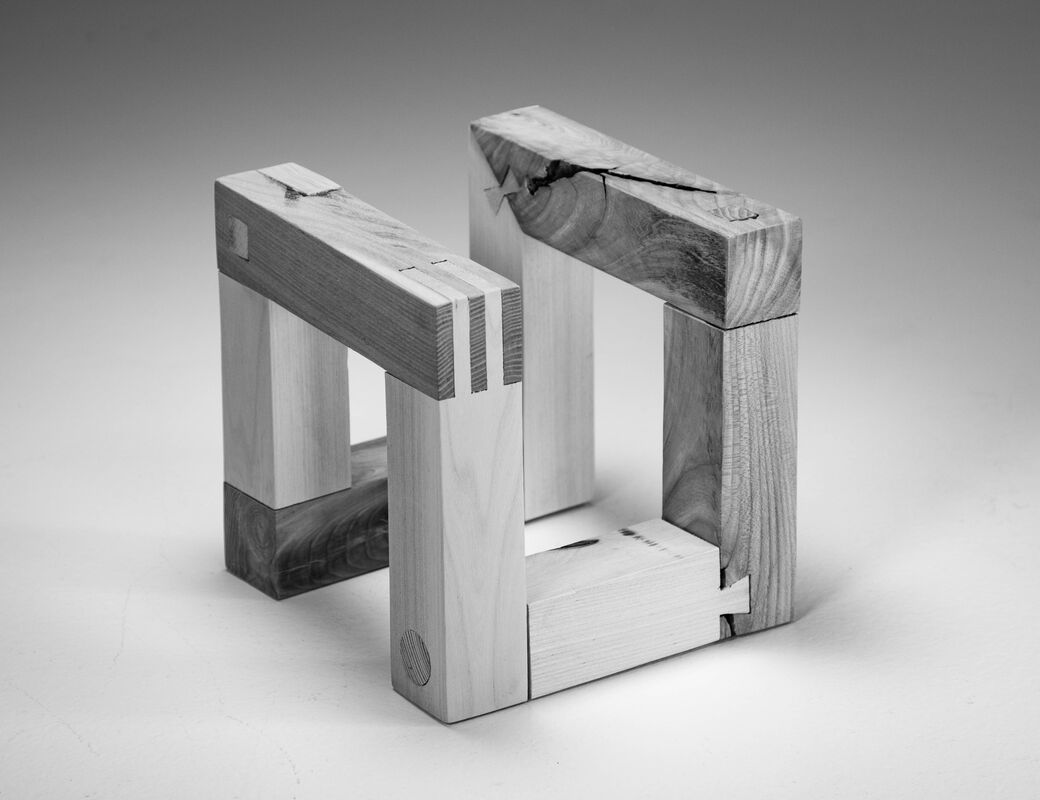 cube consisting of different species of wood joined together with different joining methods