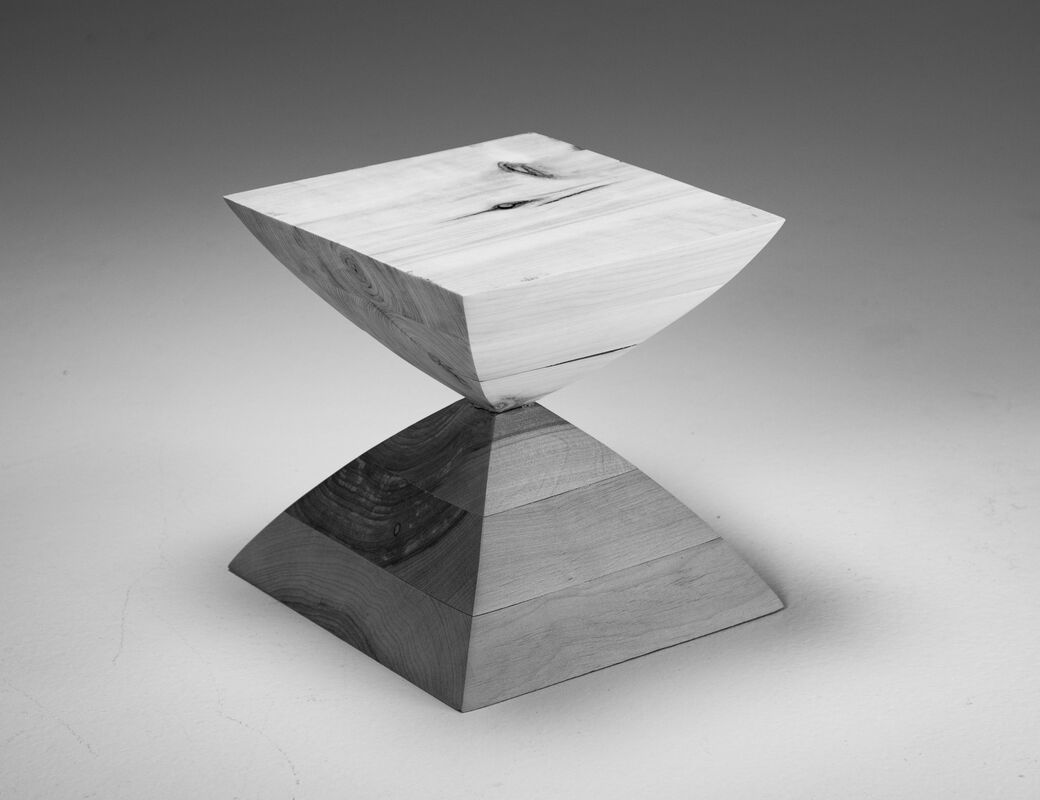 cube resembling an hourglass, of two different species